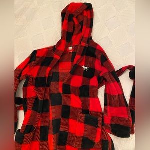 pink black and red checkered fuzzy robe with sequined sparkly logo on the back